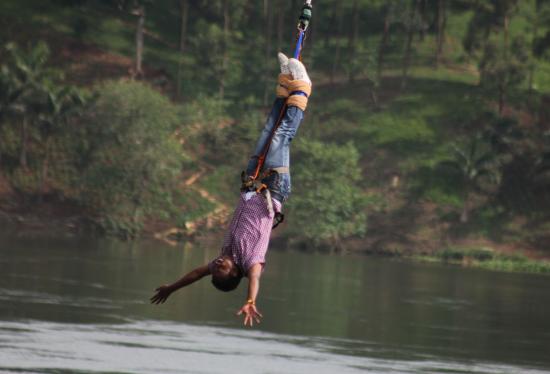 Tourist bungee jumping over River Nile